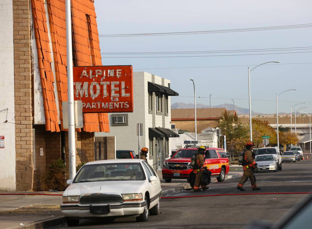 Las Vegas firefighters work the scene of a fire at a three-story apartment complex early Saturd ...