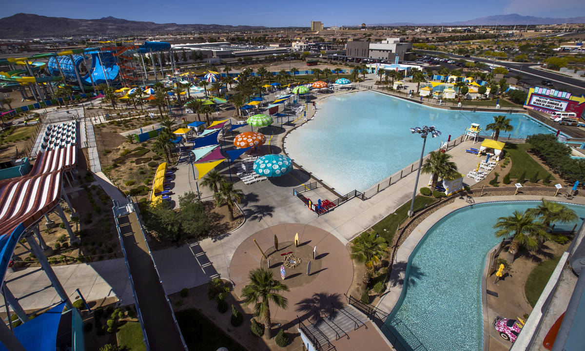 The parking lot is nearly empty and attractions currently shut down yet management and staff ar ...