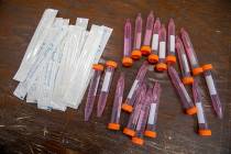 Test swabs and specimen tubes are seen on a table at a COVID-19 testing site at the Abyssinian ...