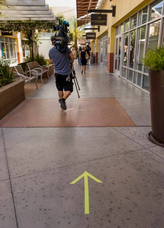 Directional walking arrows on the ground are one of the many customer information signs now ins ...