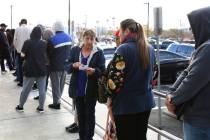 People wait in line at One-Stop Career Center on Tuesday, March 17, 2020, in Las Vegas. (Bizua ...