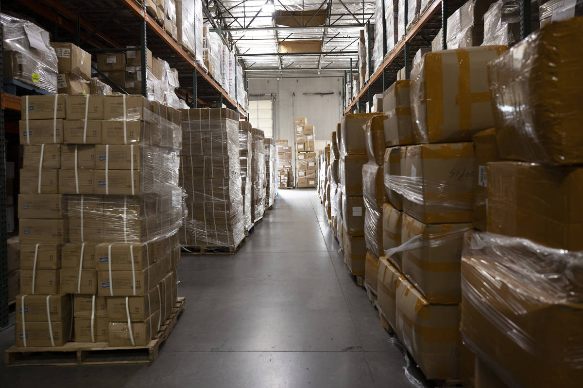 The pallets on the left hold hand sanitizer while the ones on the right hold KN95 masks at Eagl ...