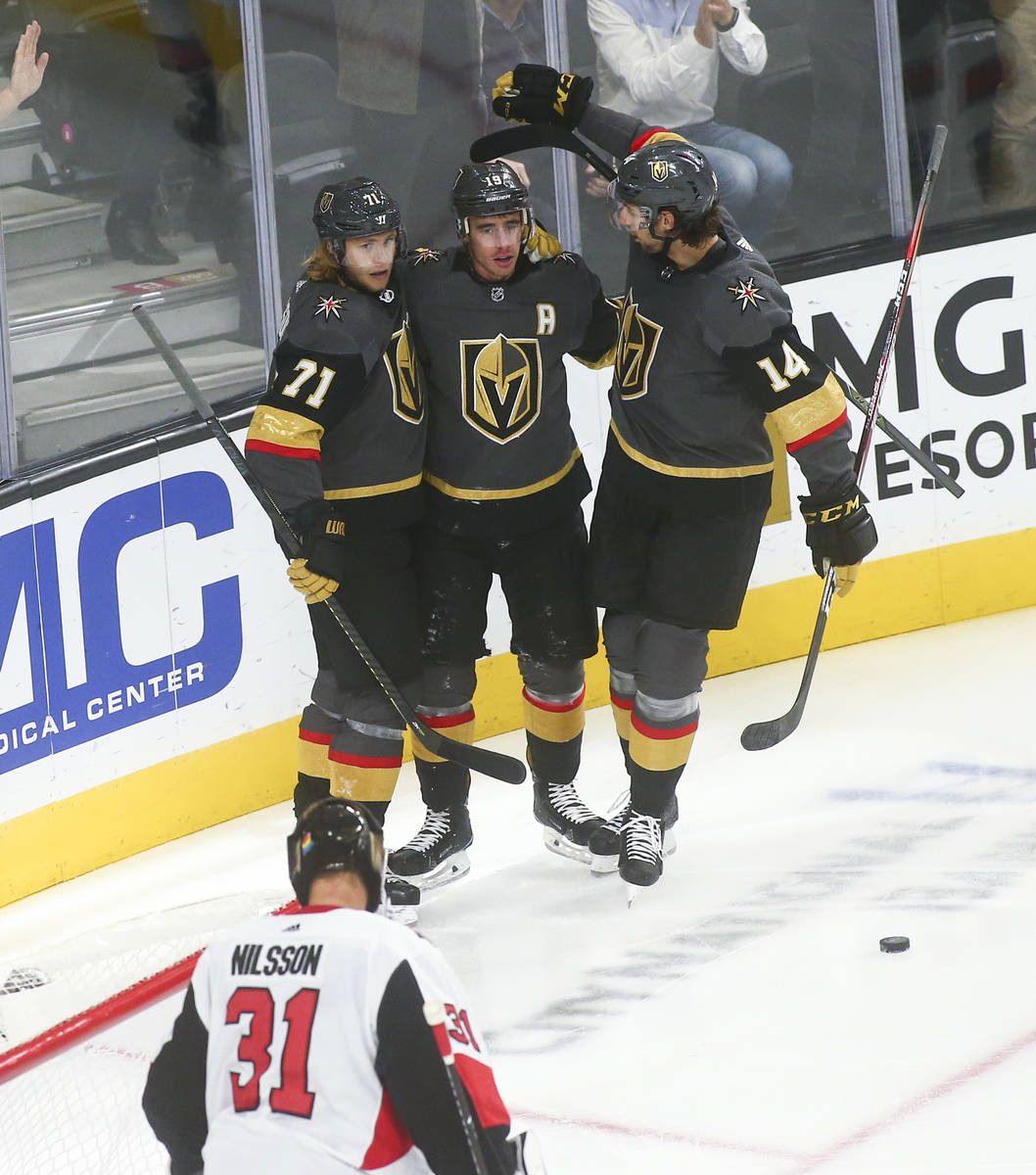 Golden Knights' Reilly Smith (19) celebrates his goal with William Karlsson (71) and Nic Hague ...