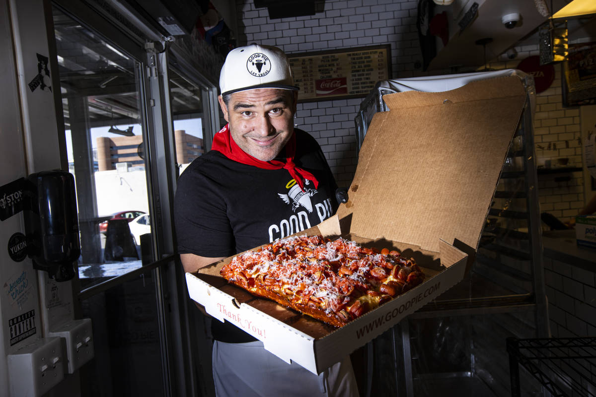 Vincent Rotolo, owner of Good Pie, poses with a triple pepperoni Detroit style pizza in downtow ...
