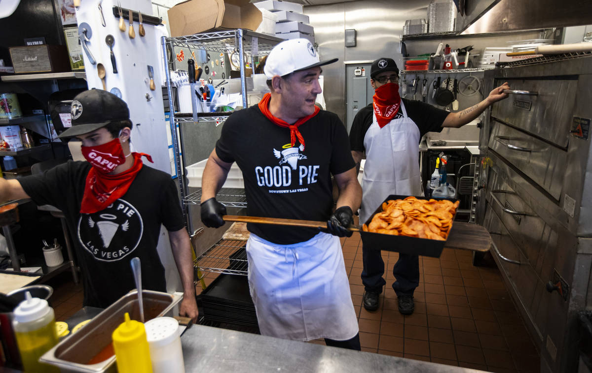 Vincent Rotolo, owner of Good Pie, prepares a triple pepperoni Detroit style pizza in downtown ...