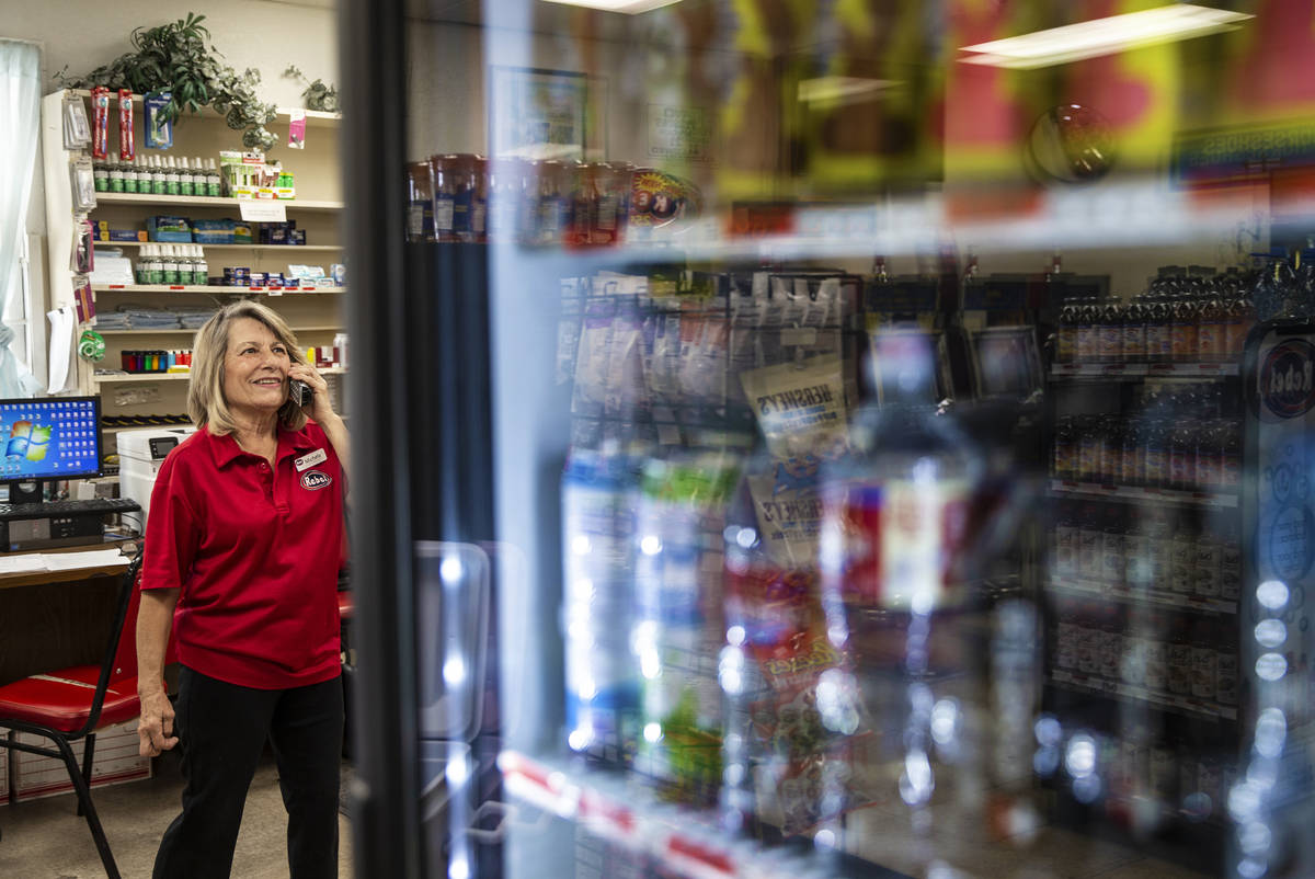 Store clerk Michele Schaffer answers the phone at Village Market Mercantile in Blue Diamond on ...