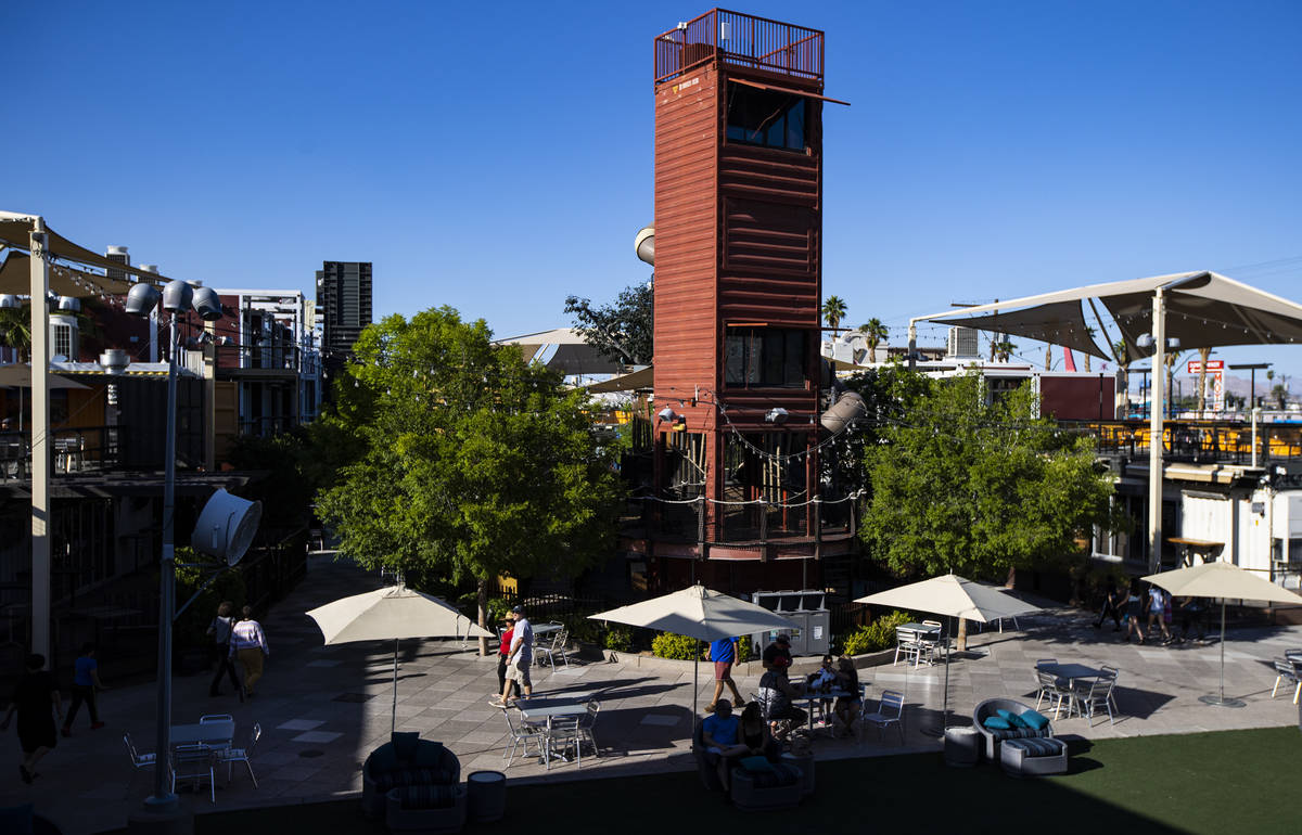 People walk around the Downtown Container Park on the first day of its reopening in downtown La ...