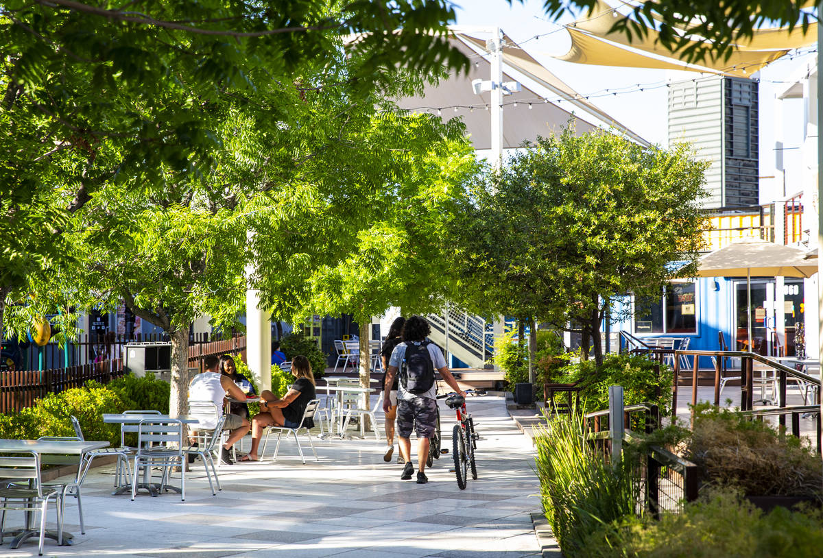 People walk around the Downtown Container Park on the first day of its reopening in downtown La ...