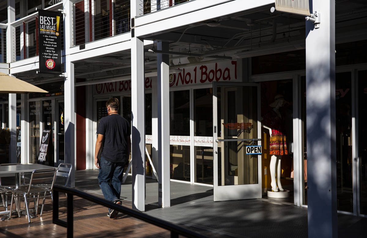 People walk around the Downtown Container Park on the first day of its reopening in downtown La ...