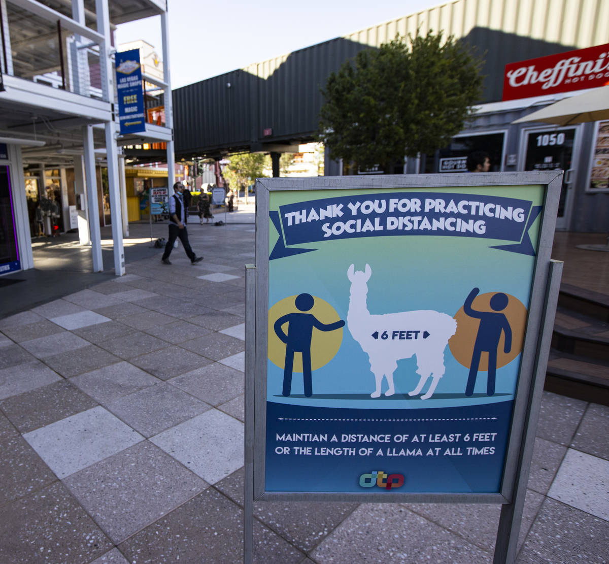 Social distancing signage at the Downtown Container Park on the first day of its reopening in d ...