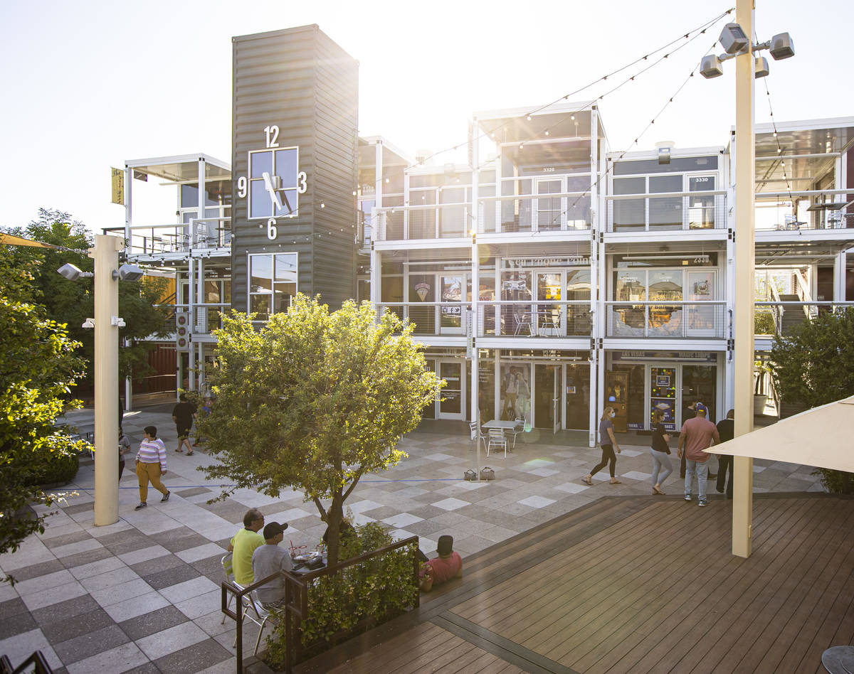 People walk around the Downtown Container Park on the first day of its reopening in downtown La ...