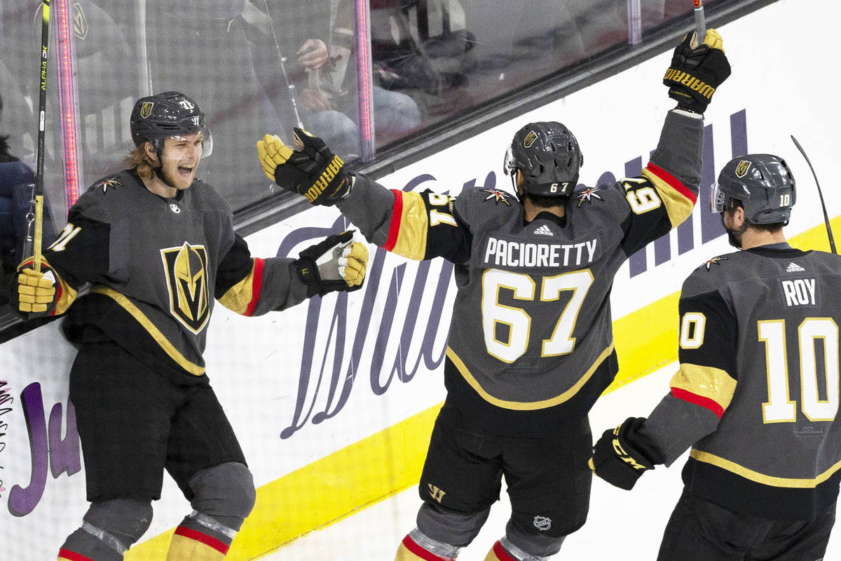 Vegas Golden Knights center William Karlsson (71) celebrates with Vegas Golden Knights left win ...