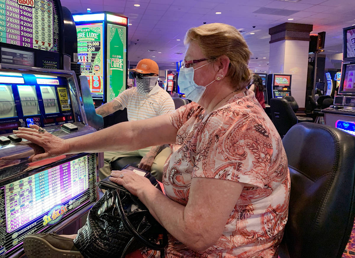 Kathy Imes, 64, of Maricopa, Arizona, plays slots during the reopening of Harrah's Ak-Chin Casi ...
