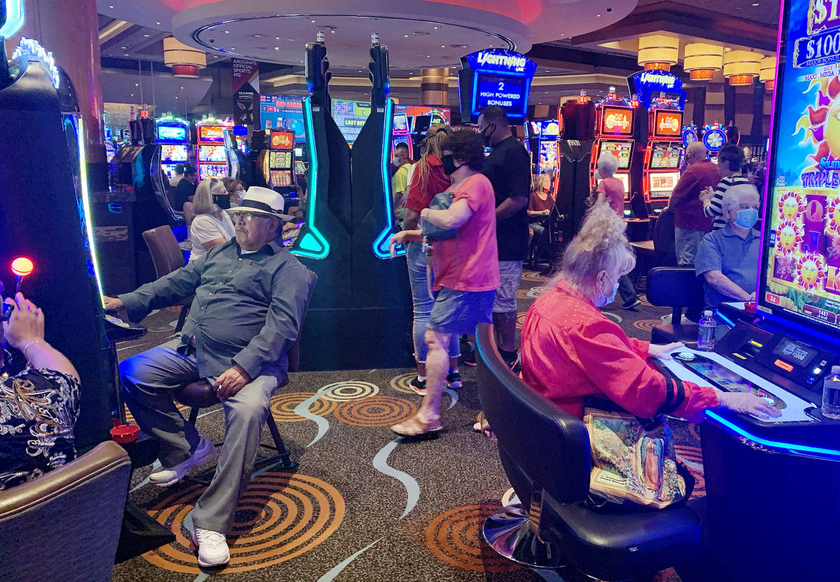 Individuals play games at Gila River Casino at the Wild Horse Pass location on the packed reope ...