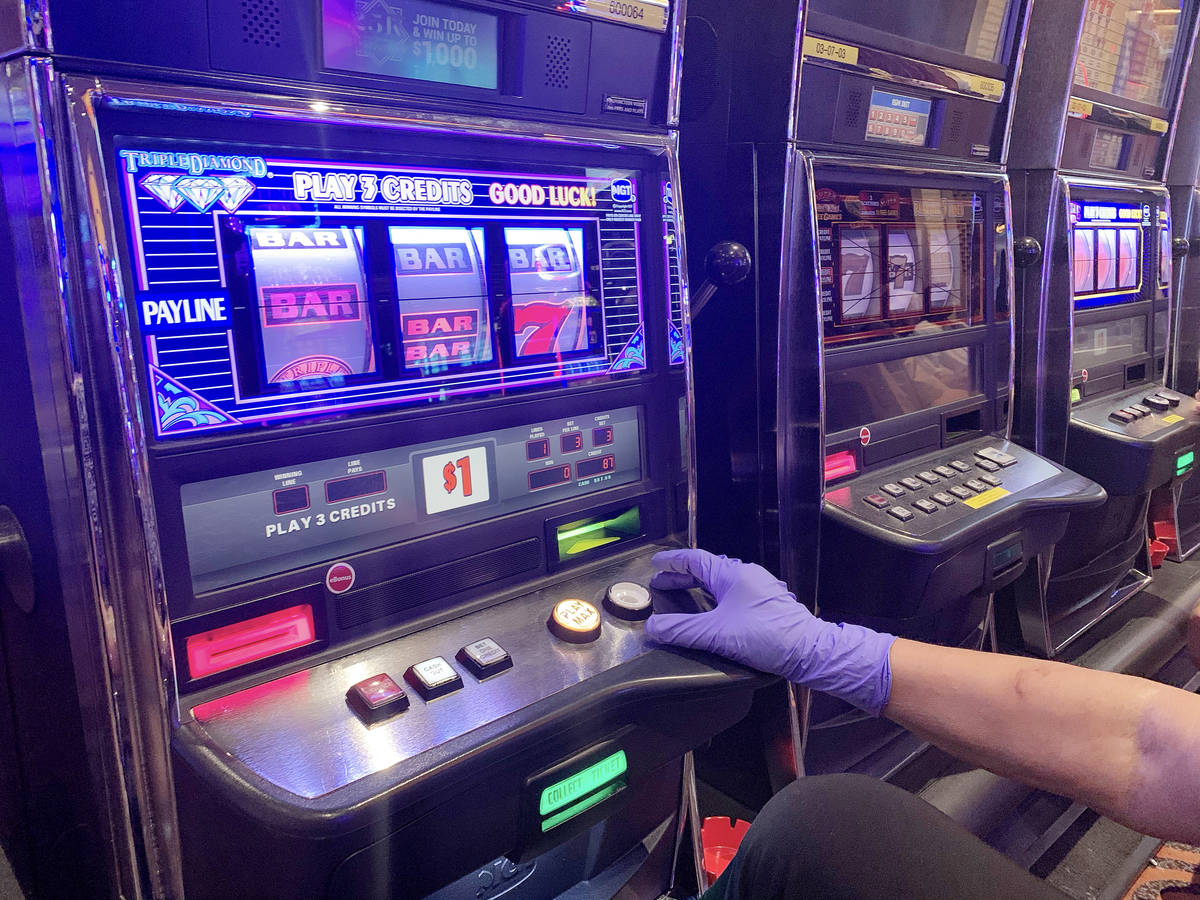 An individual gambles at Gila River Casino at the Wild Horse Pass location on the packed reopen ...