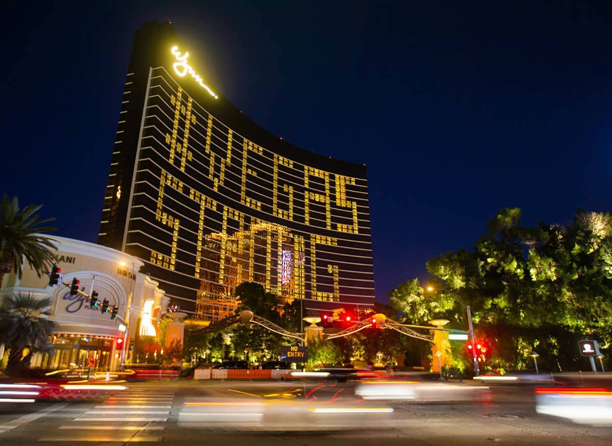 Traffic on the Strip passes by signage on Wynn Las Vegas showing support for the city during th ...