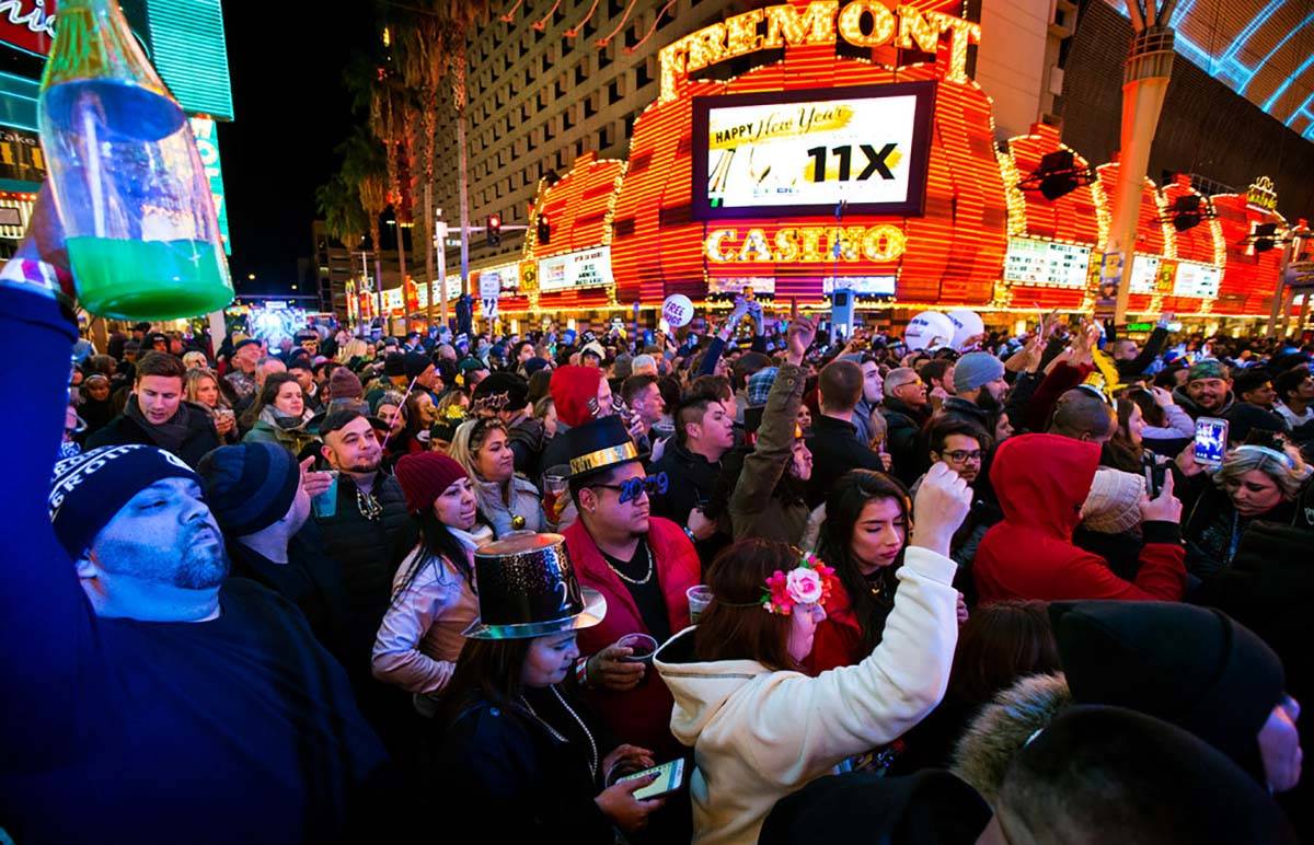 New Year's Eve revelers gather at a stage at the Fremont Street Experience in downtown Las Vega ...