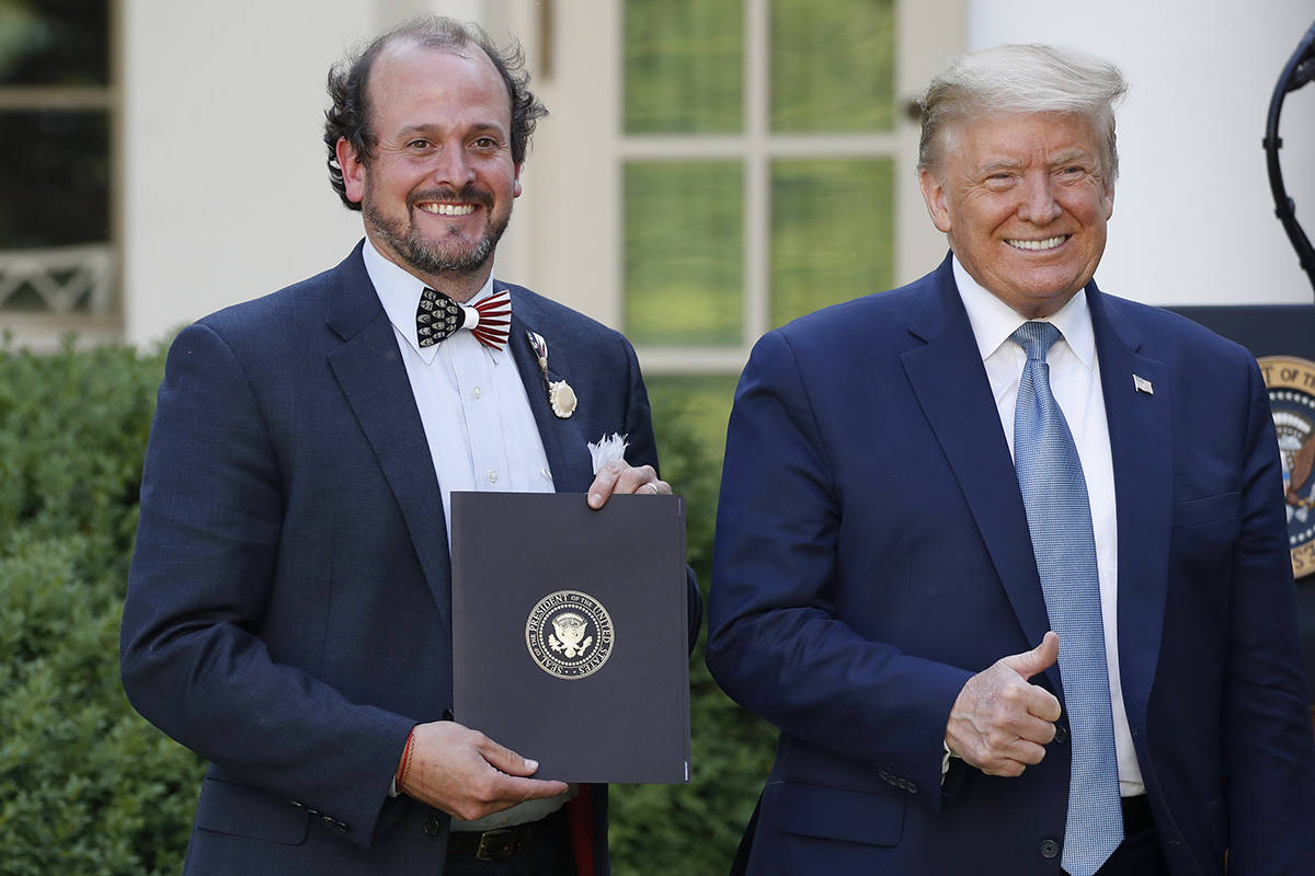 President Donald Trump poses for a photo with Ben Ross during a presidential recognition ceremo ...
