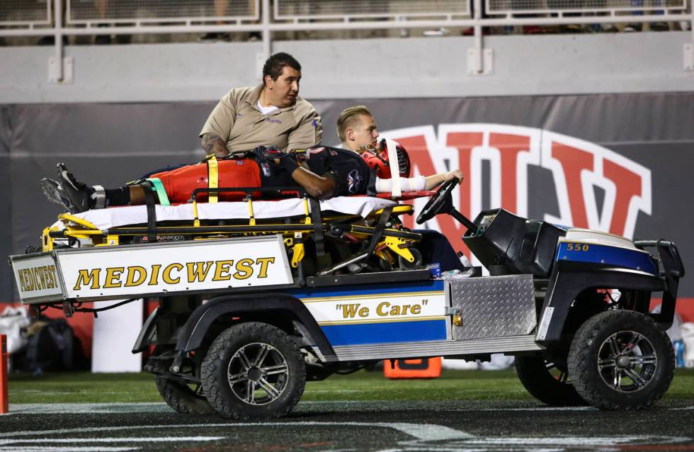 UNLV Rebels defensive back Ty'Jason Roberts (38) is taken off the field by medical staff after ...