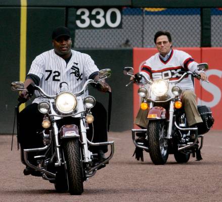 Bo Jackson, left, and Baseball Hall of Fame catcher Carlton Fisk ride into U.S. Cellular Field ...