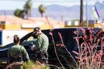 Las Vegas police investigate the scene of a shooting at Tropicana Avenue and Maryland Parkway i ...