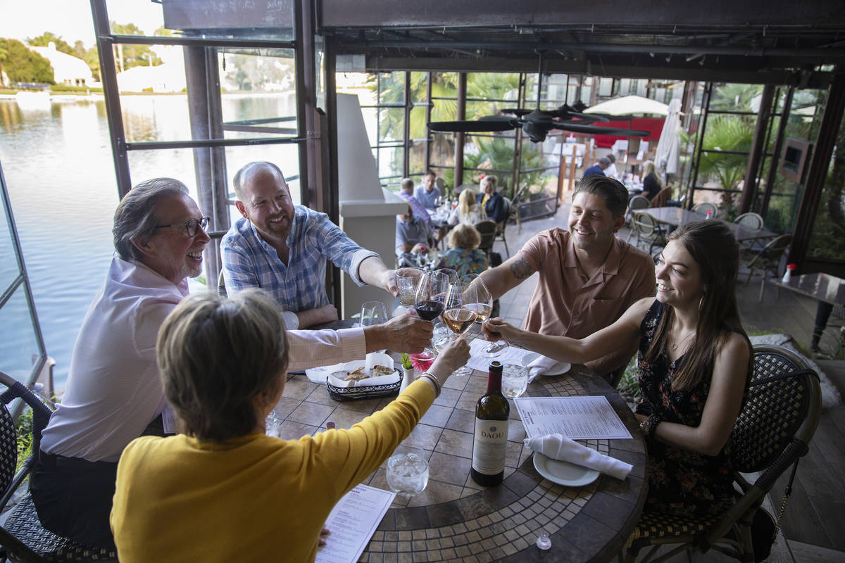 Cliff Miller, left, Rusty Miller, Michael Craigwood and Miranda Beckum raise their wine glasses ...