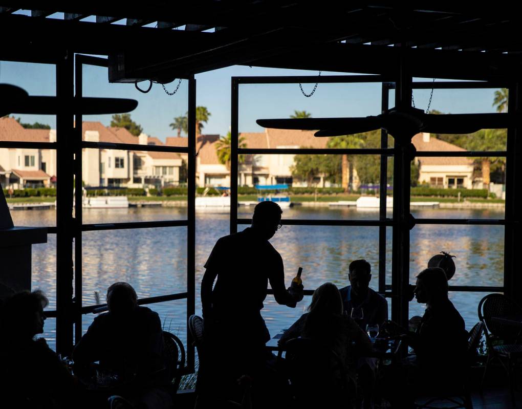 Diners enjoy a meal on the patio at Marché Bacchus on Friday, May 15, 2020, in Las Vegas. ...