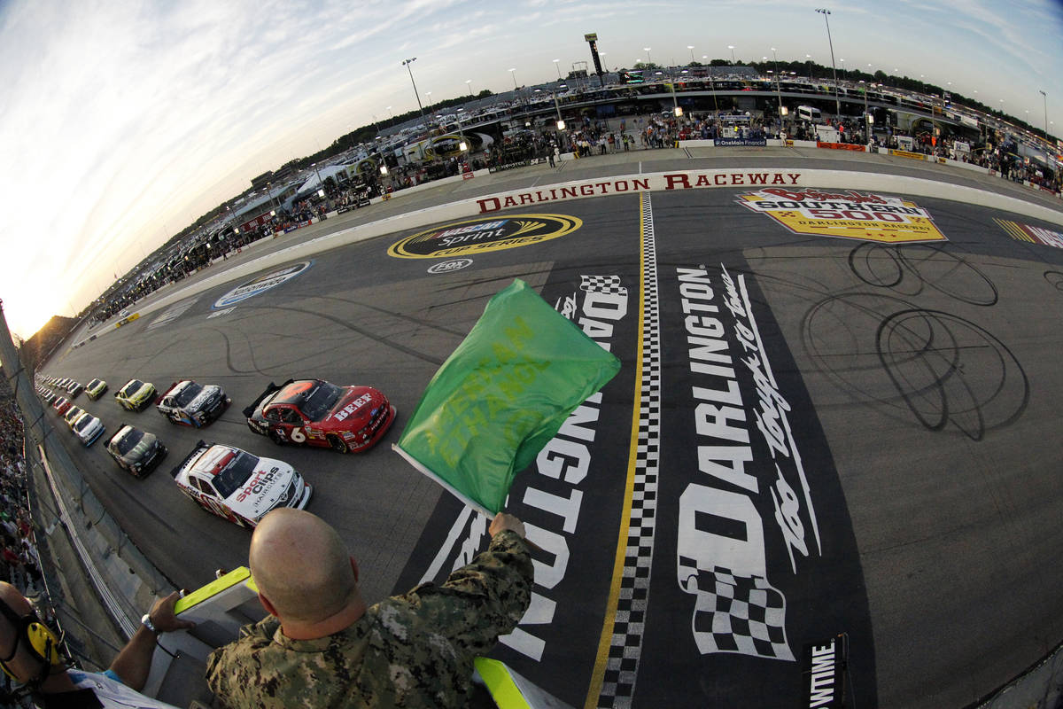 FILE - In this May 11, 2012, file photo, drivers take the green flag for the start of the NASCA ...