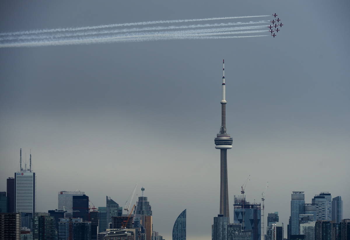 FILE-The Canadian Snowbirds circle the CN Tower as part of Operation Inspiration during the COV ...