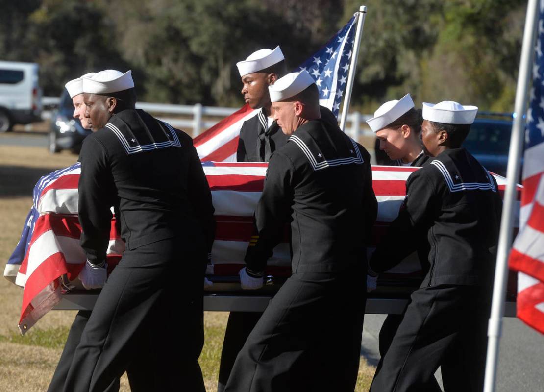 FILE - In this Dec. 16, 2019 file photo, sailors carry the casket of Cameron Walters at Oak Hil ...