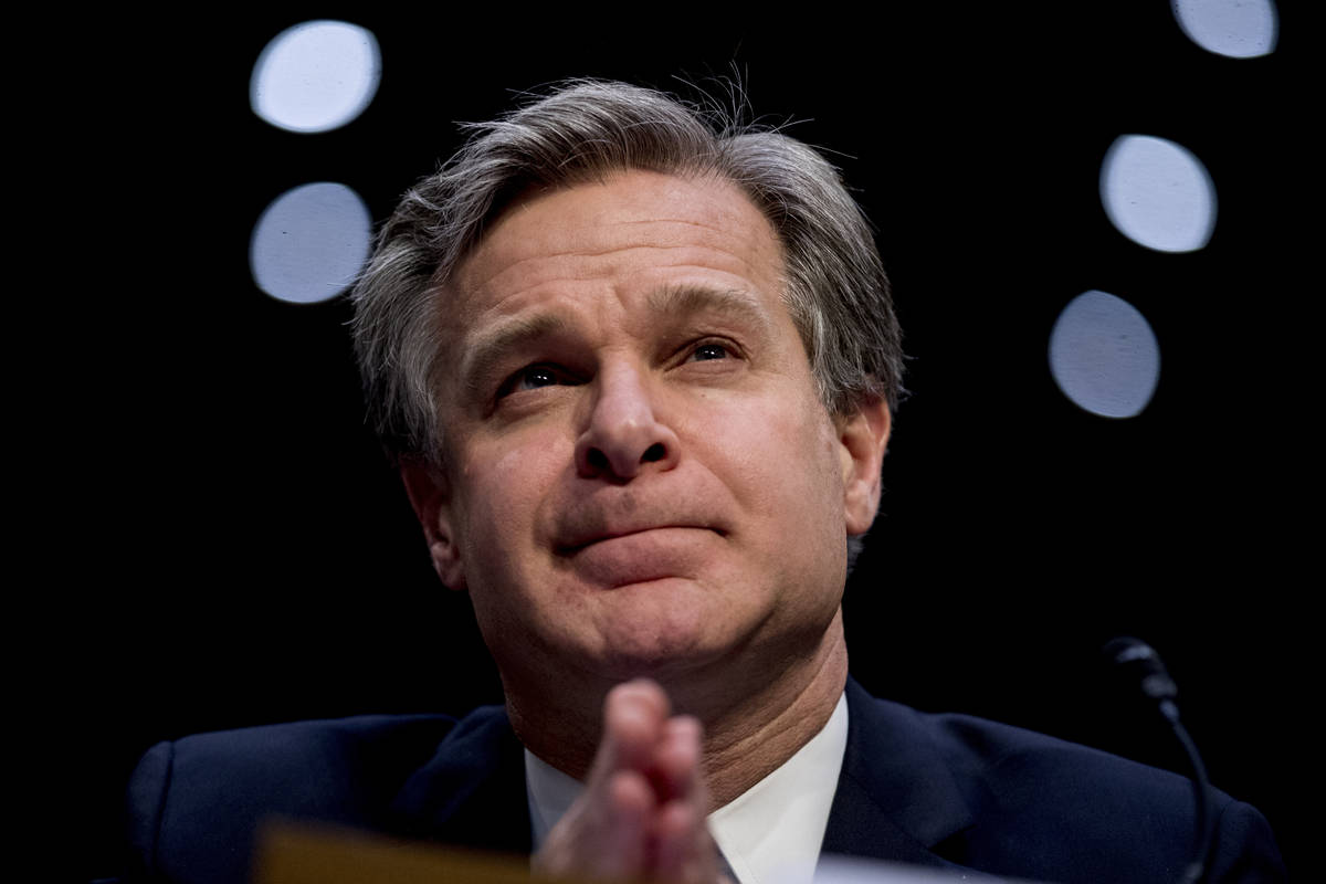 FILE - In this Nov. 5, 2019 file photo, FBI Director Christopher Wray pauses while testifying b ...