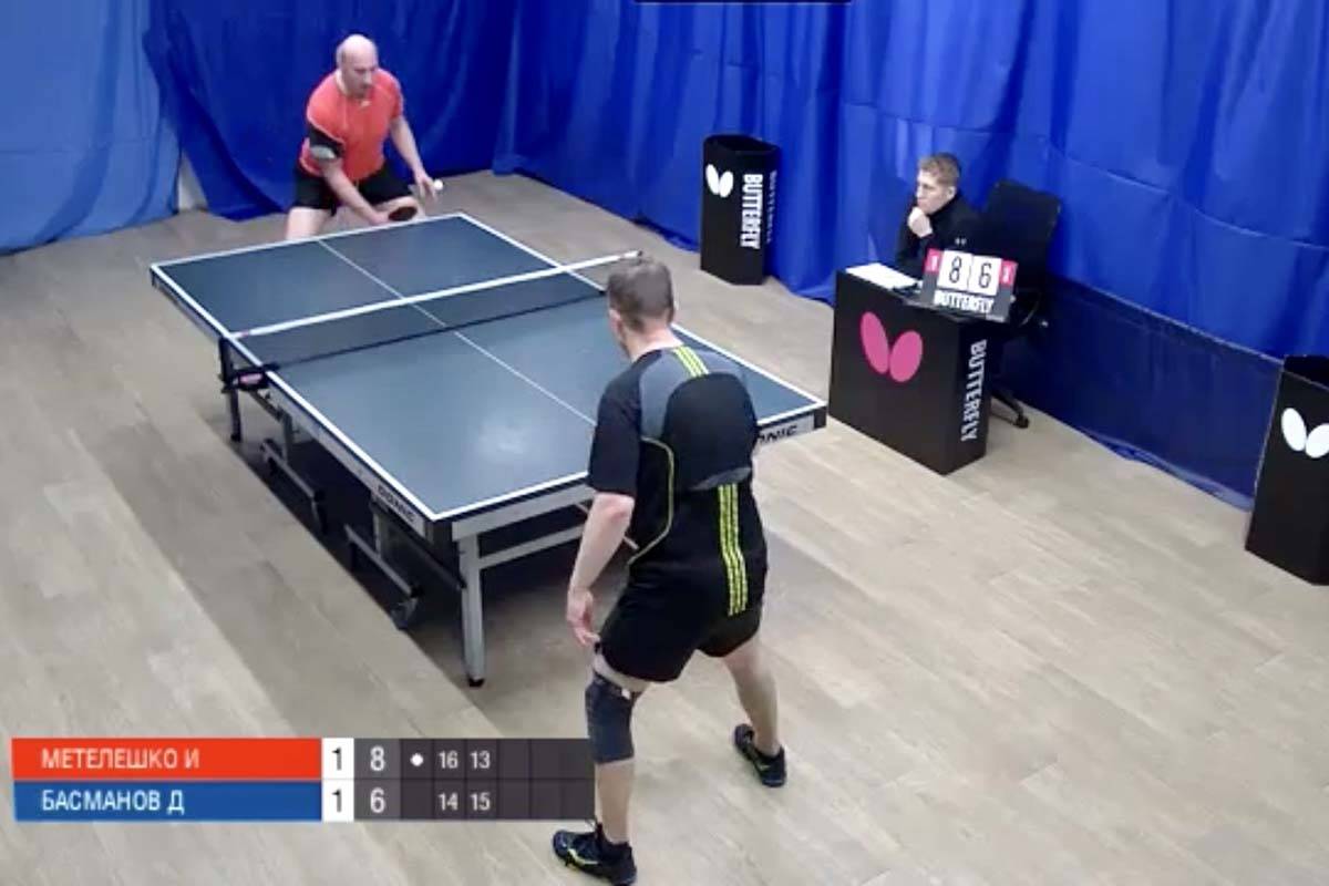 Igor Meteleshko (in red) takes on Dmitry Basmanov in a Moscow Liga Pro table tennis match Wedne ...