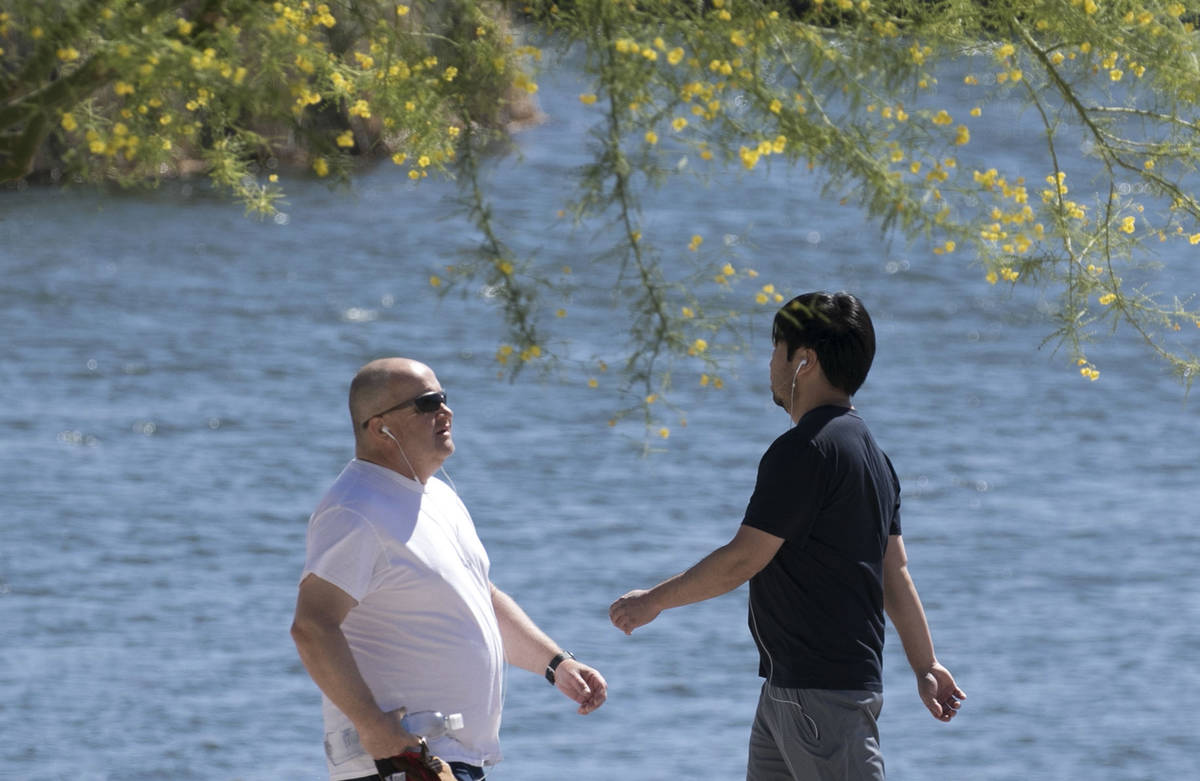 People walk at Cornerstone Park on Tuesday, May 19, 2020, in Henderson. (Bizuayehu Tesfaye/Las ...