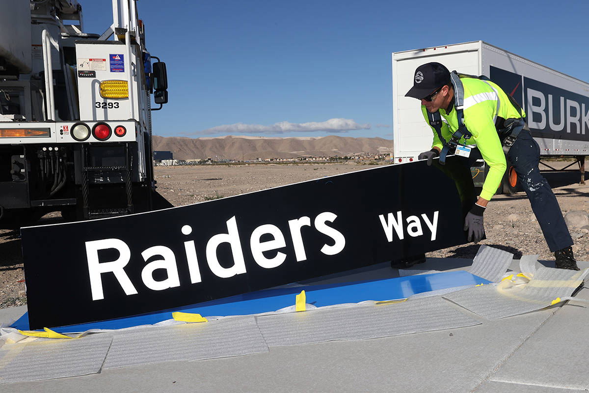Justin Buhl, traffic signal technician for the city of Henderson, gets ready to install a Raide ...