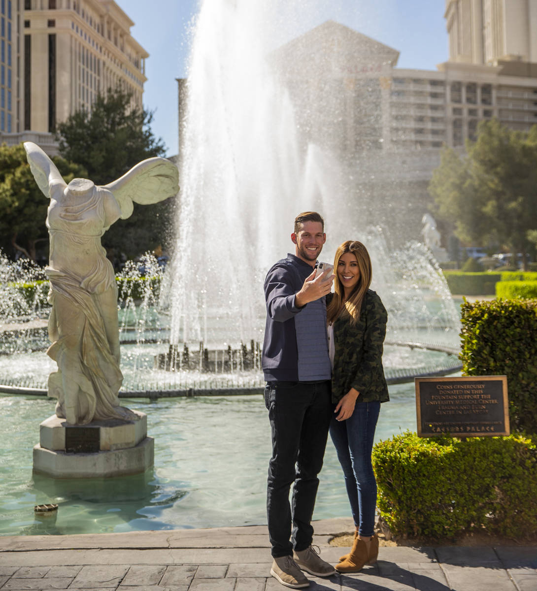 Josh Bourelle, left, and Stephanie Erives grab a selfie in front of Caesars Palace along the St ...