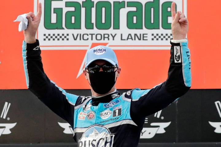 Kevin Harvick celebrates after winning the NASCAR Cup Series auto race Sunday, May 17, 2020, in ...