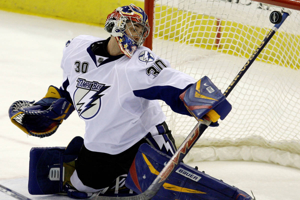 Tampa Bay Lightning goalie Mike McKenna, formerly with the Las Vegas Wranglers, makes a stick s ...