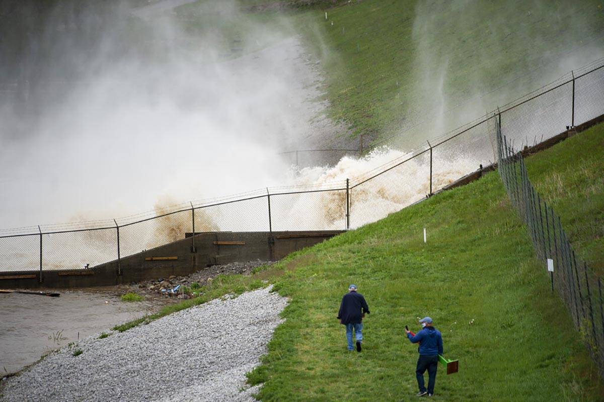This photo shows a view of a dam on Wixom Lake in Edenville, Mich., Tuesday, May 19, 2020. Peop ...