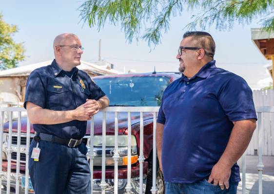 North Las Vegas Fire Chief Joseph Calhoun congratulates Jose Alvarado on Wednesday, May 20, 202 ...