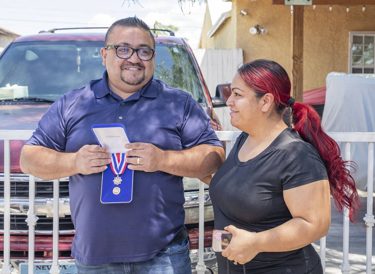 Jose Alvarado, left, and his wife Eugenia Alvarado smile after Jose received a medal of honor o ...