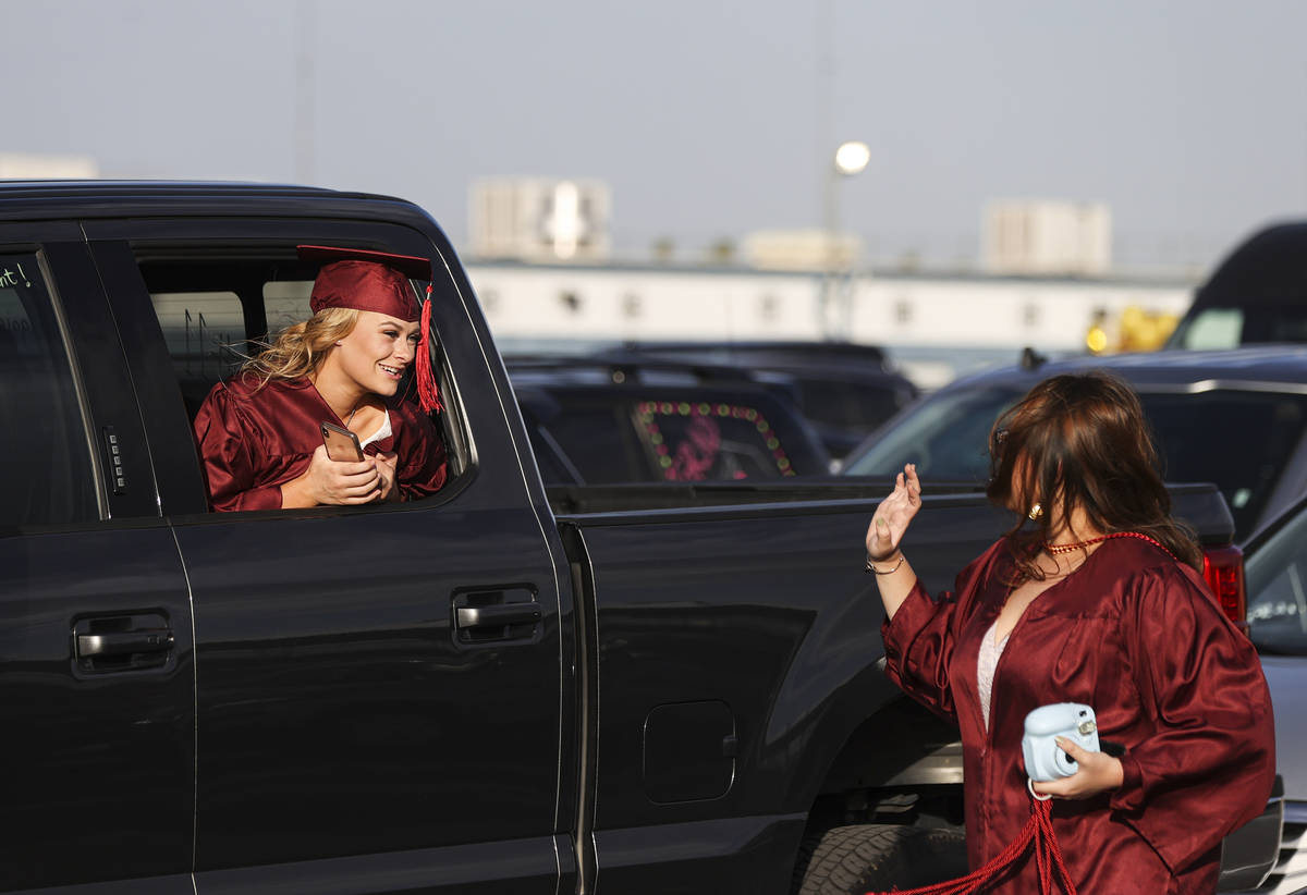 Faith Lutheran High School student Maggie Whipple, left, talks with a friend before the start o ...