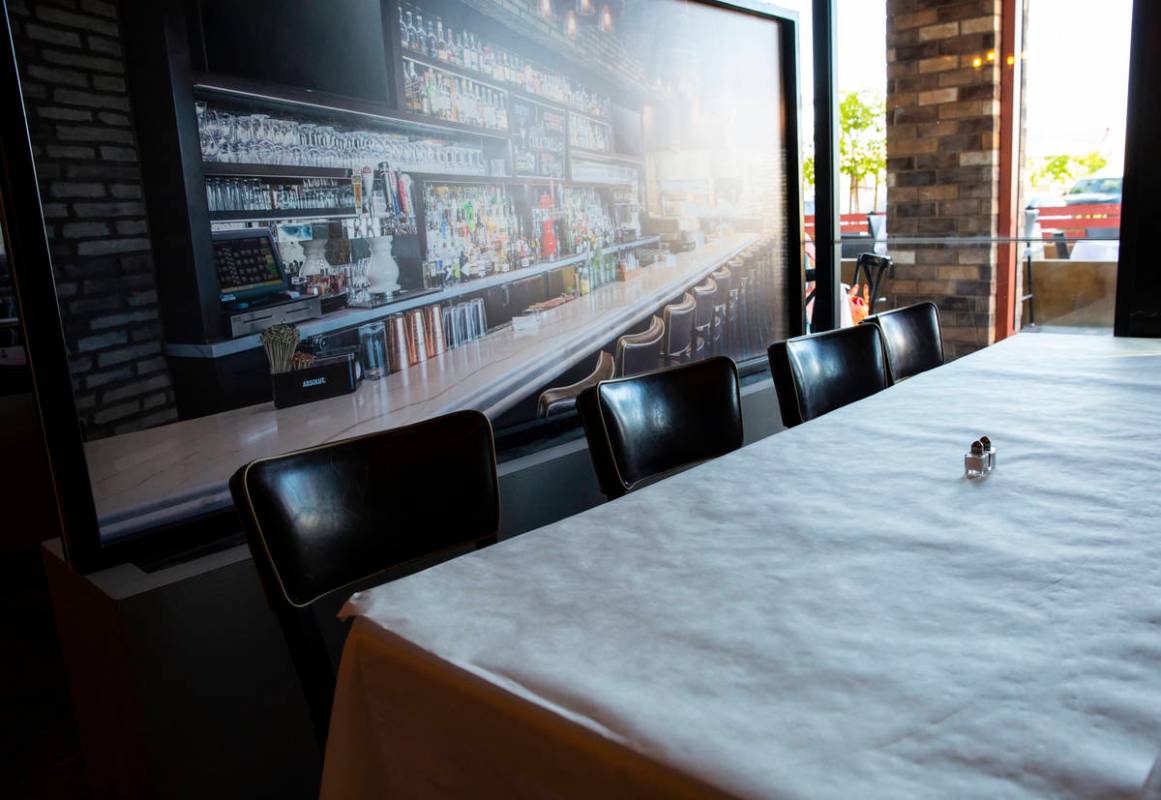 A table next to a at Nora's Italian Cuisine in Las Vegas on Thursday, May 21, 2020. (Chase Stev ...