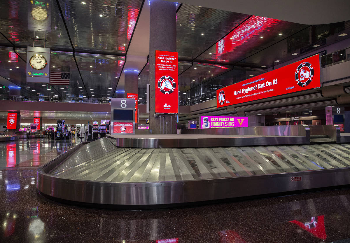 New signage outlining coronavirus safety guidelines in terminal one at McCarran International A ...