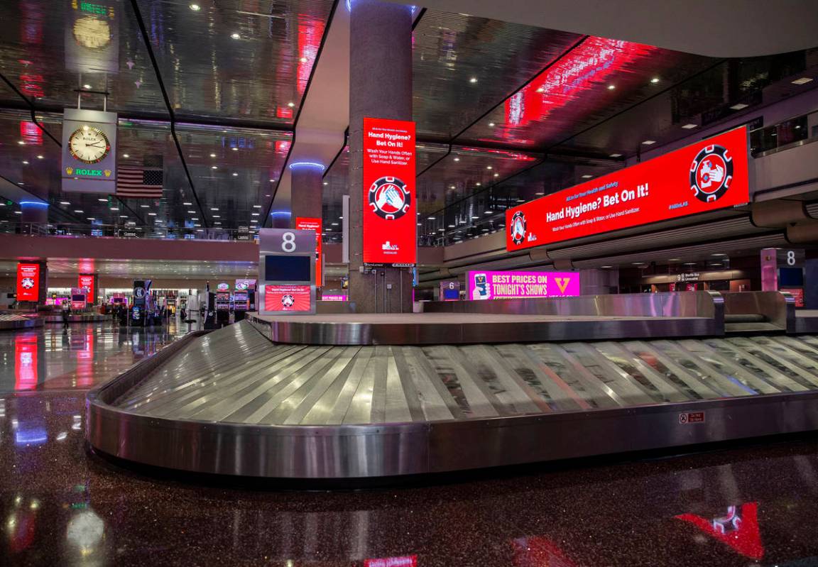 New signage outlining coronavirus safety guidelines in terminal one at McCarran International A ...