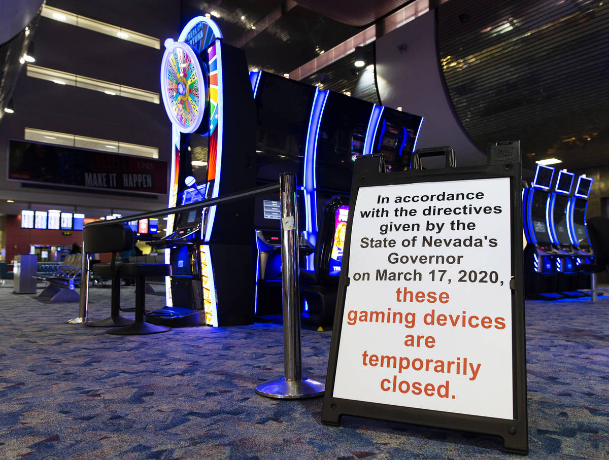 Slot machines remain closed at terminal one at McCarran International Airport on Wednesday, May ...