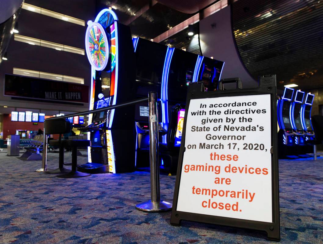 Slot machines remain closed at terminal one at McCarran International Airport on Wednesday, May ...