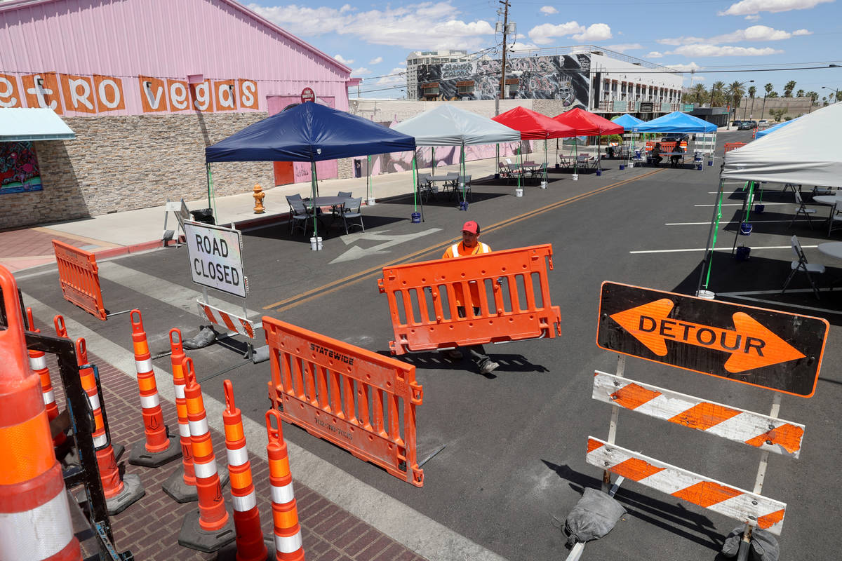 Ray Sandoval with of Work Zone Traffic Services, Inc. closes California Avenue at Main Street i ...