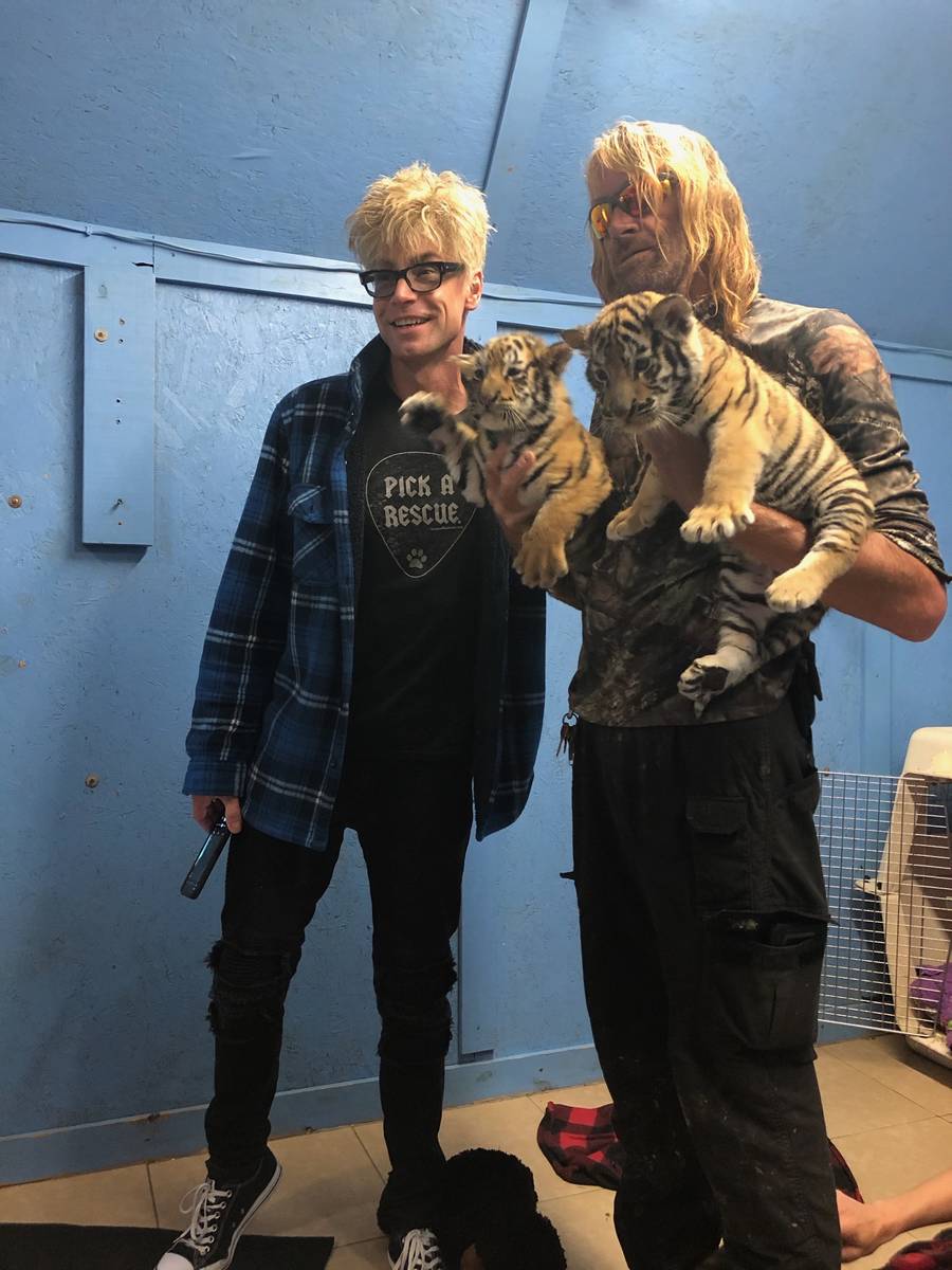 Las Vegas magician Murray Sawchuck is shown with Greater Wynewood Exotic Animal Park staffer Er ...