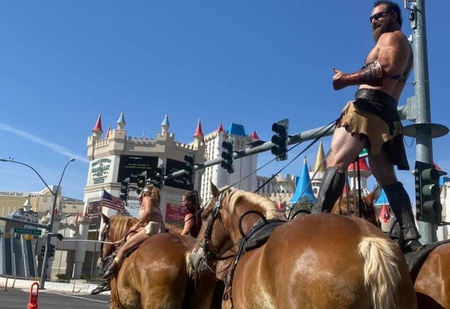 Gladius The Show co-owner Erik Martonovich and other performers ride their horses down the Str ...