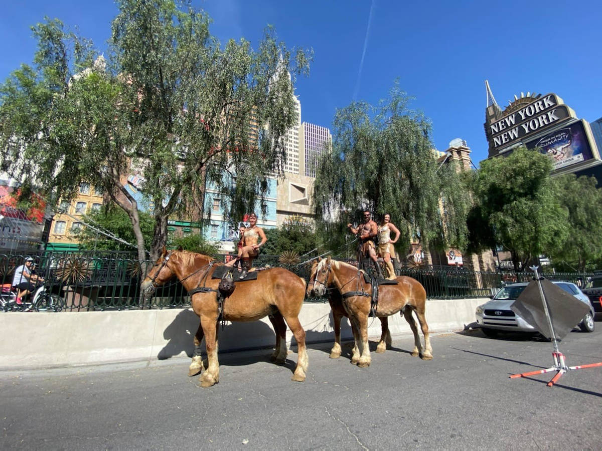 Performers from Gladius The Show ride their horses down the Strip, Friday, May 8, 2020. (Photo ...